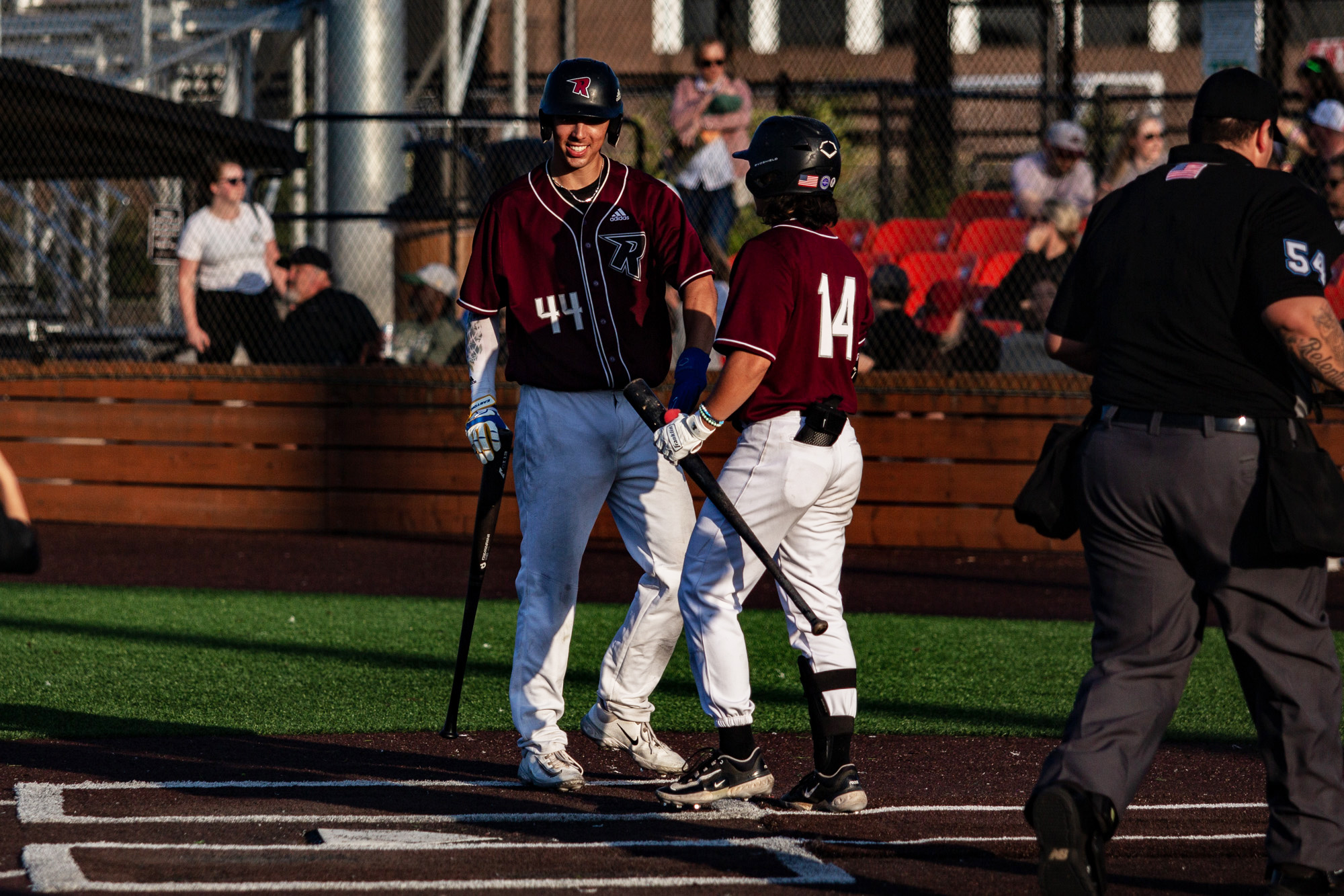 Corey Nunez and Jake Tsukada of The Ridgefield Raptors celebrate at home plate against The Bellingham Bells on Friday July 7th, 2023 at the Ridgefield Outdoor Recreation Complex.