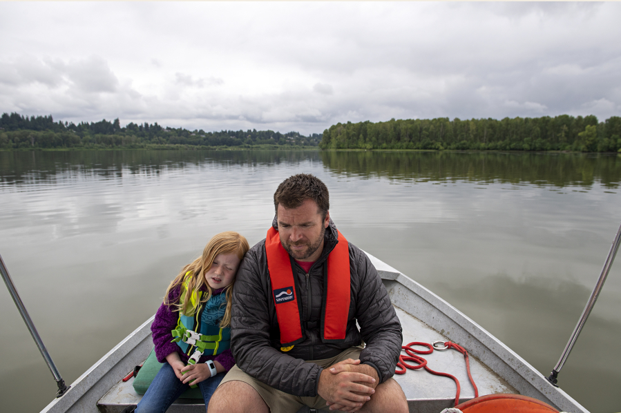 Marlow Bullis, 6, rests on the shoulder of her dad, Vancouver Rowing Club coach Conor Bullis, while on a boat tour.