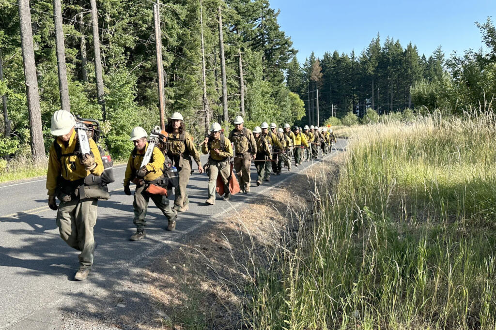 The Warm Springs Interagency Hotshot Crew moves between divisions on Friday while battling the Tunnel Five Fire in the Columbia River Gorge.