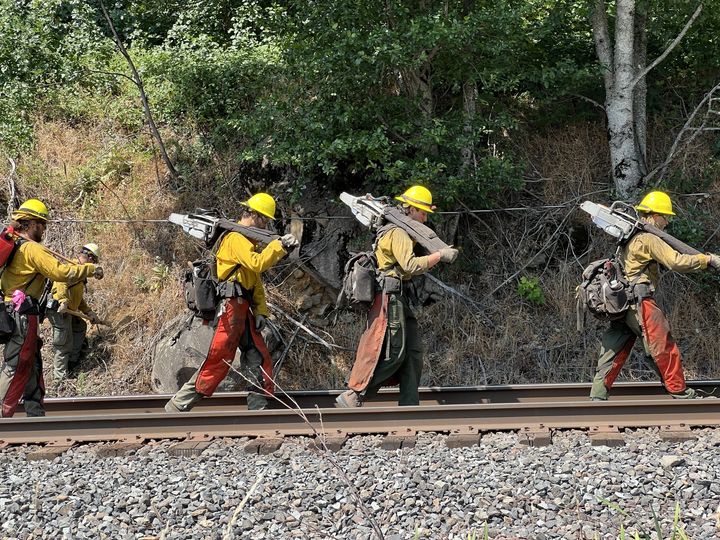 Fire crews work to establish fire lines on the Tunnel Five fire in the Columbia. River Gorge on Wednesday.