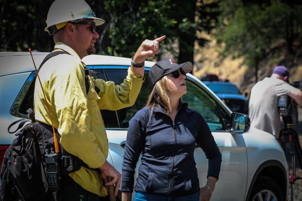 Washington State Lands Commissioner Hilary Franz talks with wildland firefighters battling the Tunnel Five Fire in the Columbia River Gorge on Thursday.