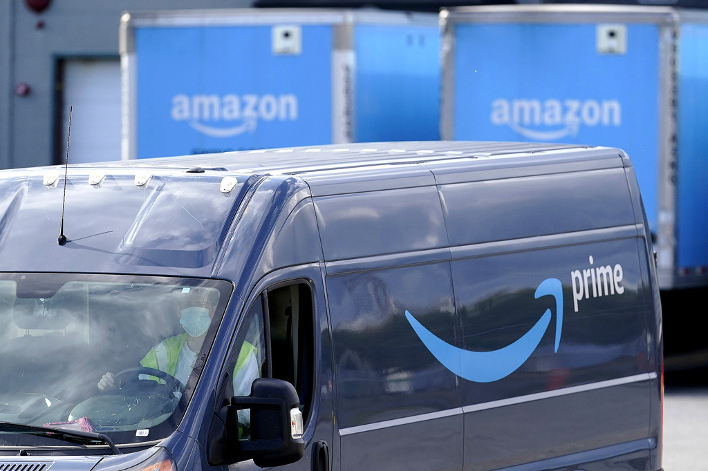 FILE - An Amazon Prime logo appears on the side of a delivery van as it departs an Amazon Warehouse location in Dedham, Mass., Oct. 1, 2020. Amazon Prime Day kicks off on Tuesday, July 11, 2023. And, once again, experts are warning consumers of scams.