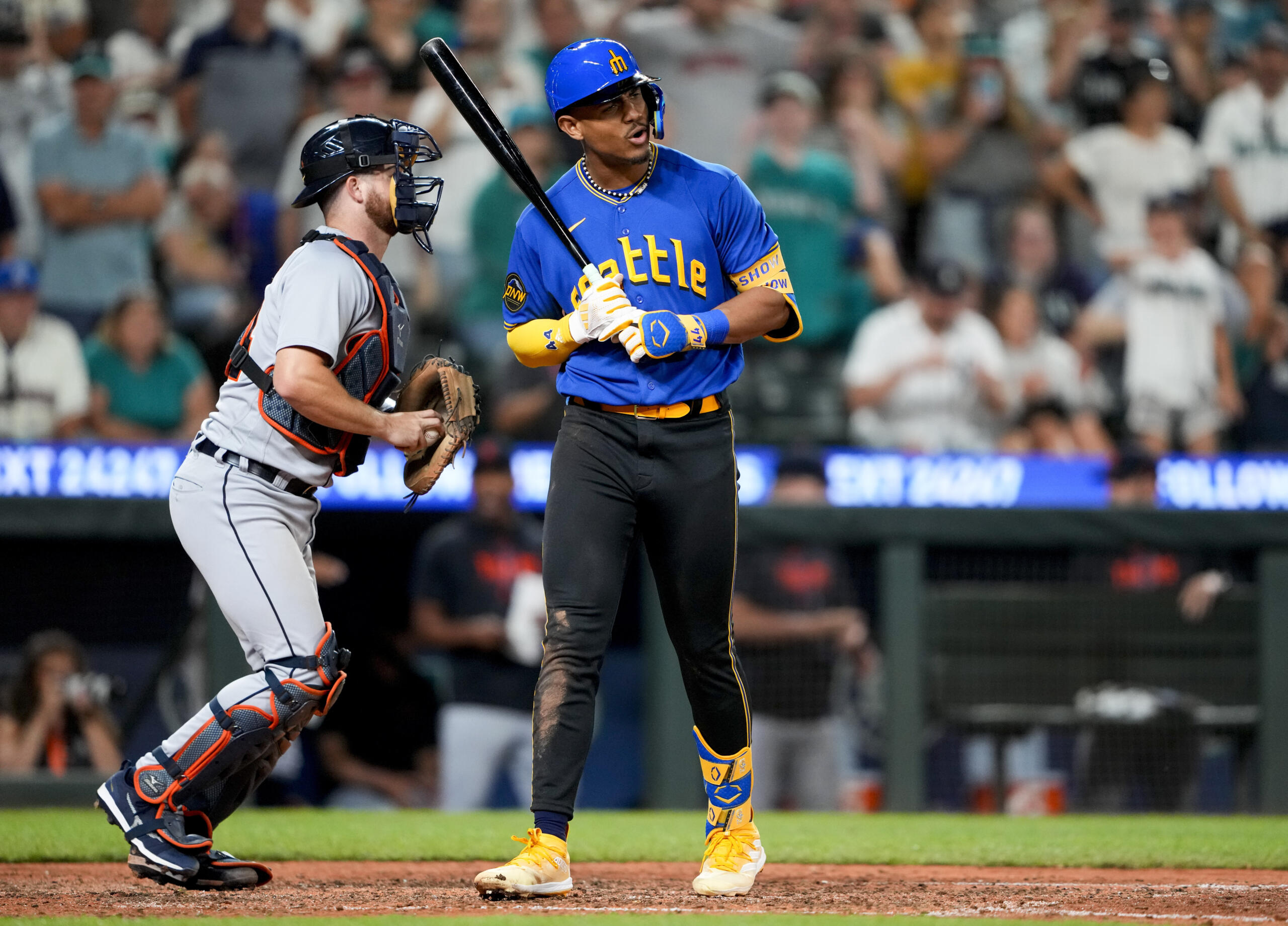 Seattle Mariners' Julio Rodriguez reacts to striking out looking to end the baseball game, next to Detroit Tigers catcher Jake Rogers on Friday, July 14, 2023, in Seattle. Detroit won 5-4.
