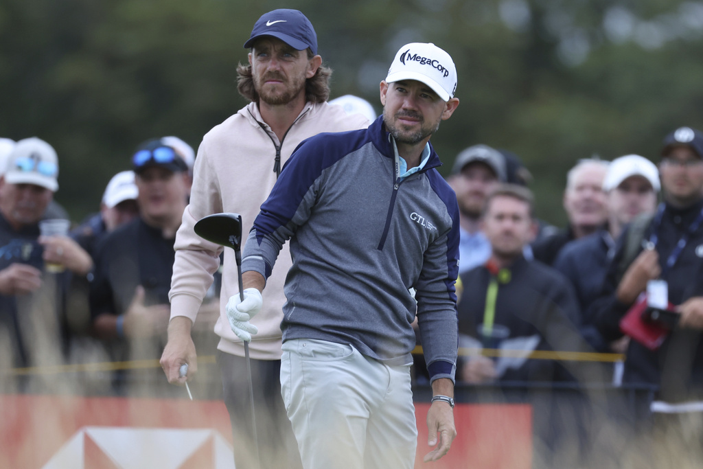 United States' Brian Harman, right and England's Tommy Fleetwood look down the 14th hole from the tee during the third day of the British Open Golf Championships at the Royal Liverpool Golf Club in Hoylake, England, Saturday, July 22, 2023.
