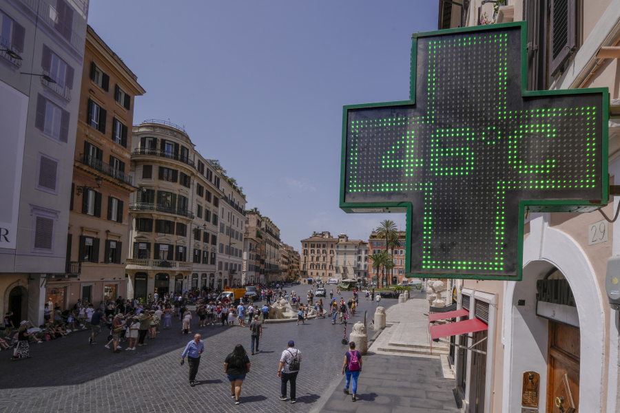 A Pharmacy shop sign displays the outside temperature of 46 Celsius degrees (114.8 F) in downtown Rome, Tuesday, July 18, 2023. Temperatures in Italy are officially registered only by the Italian Air Force's weather service while high temperatures picked by private stations need to be verified by the World Meteorological Organization, which only Monday accepted a new temperature record for continental Europe of 48.8 Celsius degrees (119.8 F), measured in Sicily on Aug. 11, 2021.