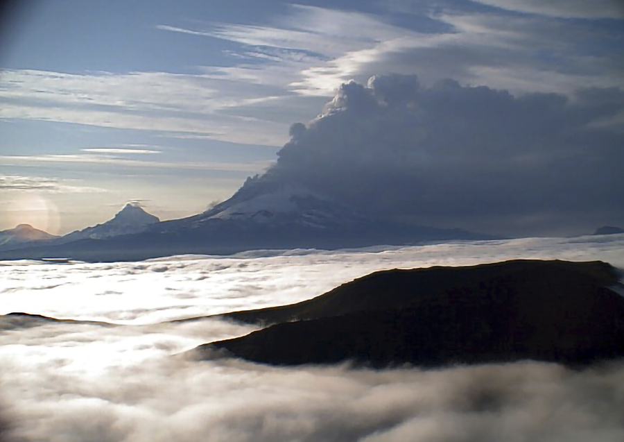 This web camera image provided by the U.S. Geological Survey shows a low-level ash plume from the Shishaldin Volcano captured on Tuesday, July 18, 2023. An ongoing eruption of a remote volcano in Alaska's Aleutian Islands produced an ash cloud so large Tuesday warnings were sent to pilots about potentially dangerous conditions.(Alaska Volcano Observatory/U.S.
