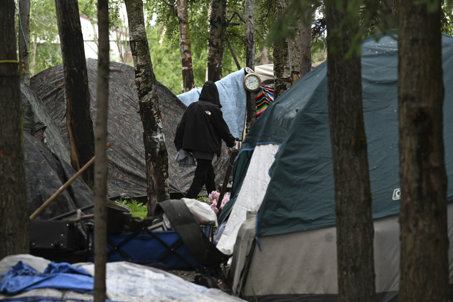Tents fill a homeless camp near Davis Park in Mountain View, Monday, July 3, 2023, in Anchorage, Alaska. An unfunded proposal by Anchorage's mayor to pay for plane tickets to warmer climates for homeless people who would otherwise be forced to winter outside in the bitter cold has caused a stir in Alaska's biggest city. If the program moves forward, people can choose to relocate to the Lower 48 or somewhere else in Alaska where it might be warmer or where they have relatives.