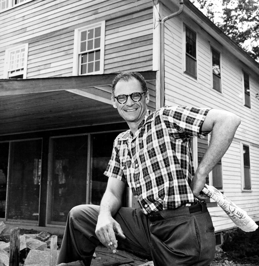 Playwright Arthur Miller poses Aug. 7, 1958 in front of his farmhouse, where he lives with his actress wife, in Roxbury, Conn.