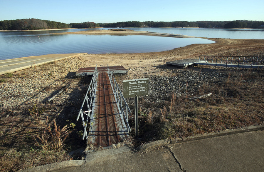 Floating docks rest on dry land far from the water as they are closed due to low water levels on Lake Lanier at Mary Alice Park in Cumming, Ga., Monday, Nov. 26, 2012. Mary Alice Park is a Corps of Engineers Park whose boat ramp and floating docks are closed due to low water levels. Lake Lanier is at its lowest level since the historic drought of several years ago, when lakeside businesses lost millions in recreation revenue and boaters were unable to launch their crafts. Monday's level was 1,058 feet above sea level, 13 feet below full pool. The last time Lake Lanier was at that level was in March 2009, the last days of the two-year drought that ravaged the state.