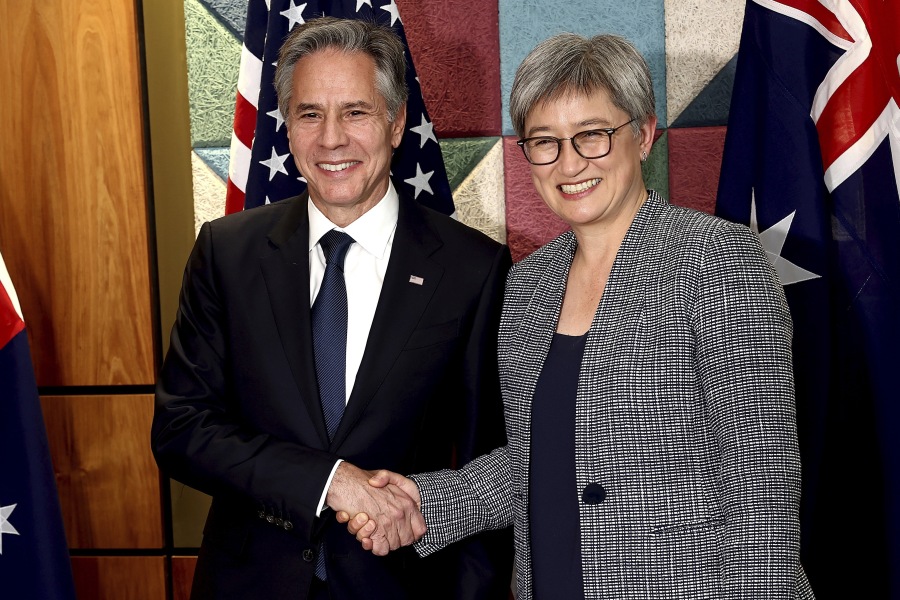 U.S. Secretary of State Antony Blinken, left, shakes hands with Australian Foreign Minister Penny Wong prior to a bilateral meeting in Brisbane, Australia Friday, July 28, 2023.