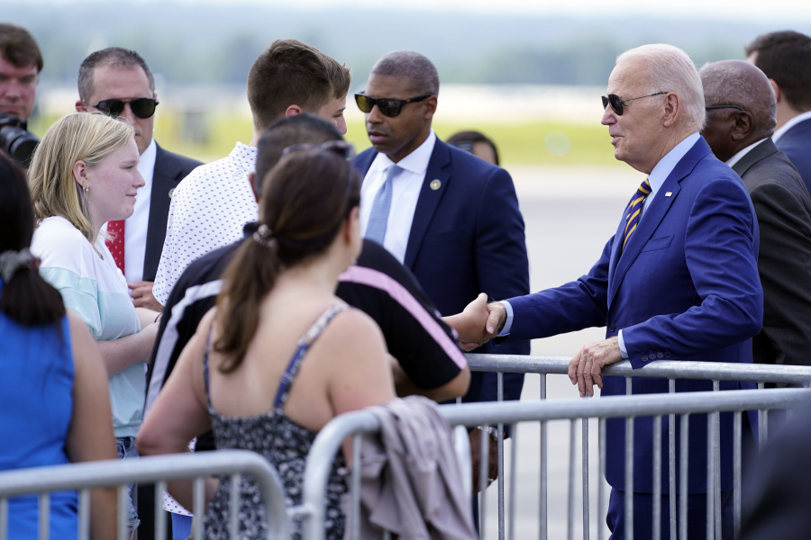 President Joe Biden greets people as he arrives at Columbia Metropolitan Airport, Thursday, July 6, 2023, in West Columbia, S.C.