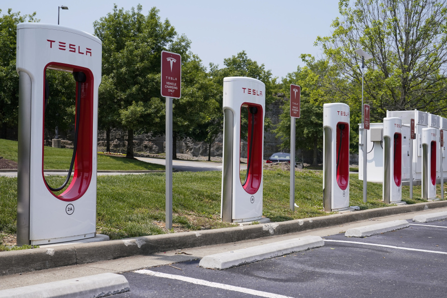 FILE - A Tesla electronic vehicle charging station is seen Thursday, May 25, 2023, in Nashville, Tenn. The Biden administration is making available $20 billion from a federal "green bank" for clean energy projects such as residential heat pumps, electric vehicle charging stations and community cooling centers.