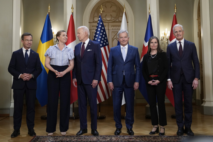 President Joe Biden speaks with Denmark's Prime Minister Mette Frederiksen, as they stand for a family photo with Nordic leaders from left, Sweden's Prime Minister Ulf Kristersson, Frederiksen, Biden, Finland's President Sauli Niinisto, Iceland's Prime Minister Katrin Jakobsdottir and Norway's Prime Minister Jonas Gahr Store, at the Presidential Palace in Helsinki, Finland, Thursday, July 13, 2023.