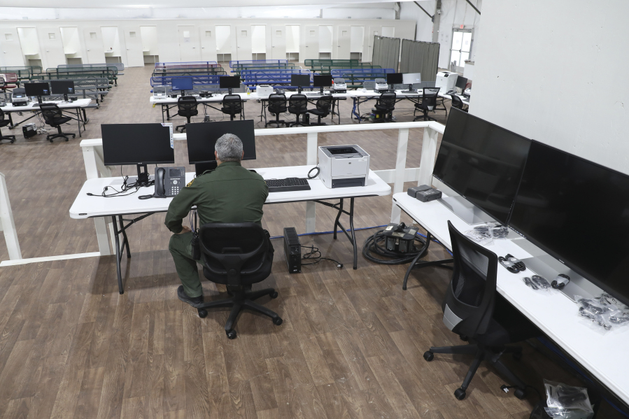 In this photo provided by the U.S. Customs and Border Protection is an interior view of the soft-sided migrant processing facility in Laredo, Texas, on Sept. 23, 2021. As the Biden administration prepared to launch speedy asylum screenings at the border in April, authorities pledged a key difference from a Trump-era version of the policy: Migrants would be guaranteed access to legal representation. Nearly three months and thousands of screenings later, the promise of attorney access appears unfulfilled. (Greg L. Davis/U.S.
