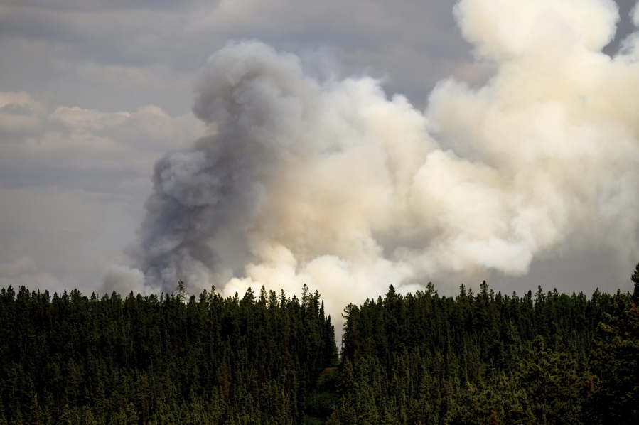 Smoke billows from the Donnie Creek wildfire burning north of Fort St. John, British Columbia, on Sunday, July 2, 2023.