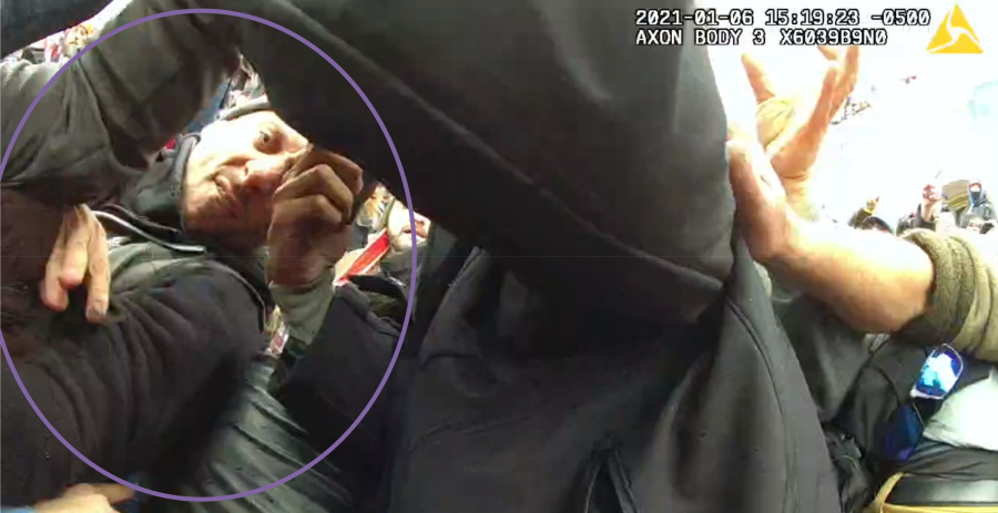 This image from the body-worn camera of Washington Metropolitan Police Department officer Michael Fanone shows Thomas Sibick, circled by the Justice Department, at left, during the riot at the U.S. Capitol on Jan. 6.  Sibick, of Buffalo, who stole a badge and radio from a police officer brutally beaten by other rioters during the attack on the U.S. Capitol was sentenced on Friday to more than four years in prison.