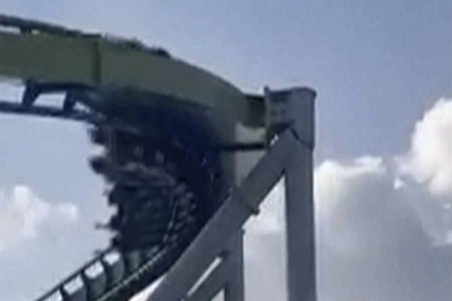 This image from video provided by Joey Mtnjunkie Puig shows a crack in a support pillar of the Fury 325 ride as a roller coaster passes by at North Carolina's Carowinds amusement park on Friday, June 30, 2023.
