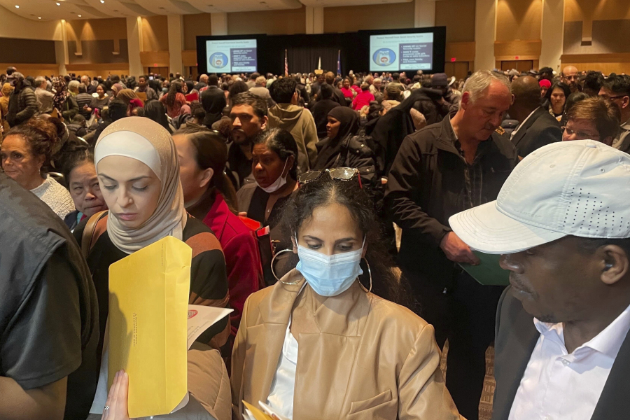 Hundreds of people become U.S. citizens during a naturalization ceremony at a convention center in Saint Paul, Minn., on March 9, 2023. The U.S. citizenship test is being updated and some immigrants and advocates worry the changes will hurt test-takers with lower levels of English proficiency. The test is one of the final steps toward citizenship -- a months-long process that requires legal permanent residency for years before applying.