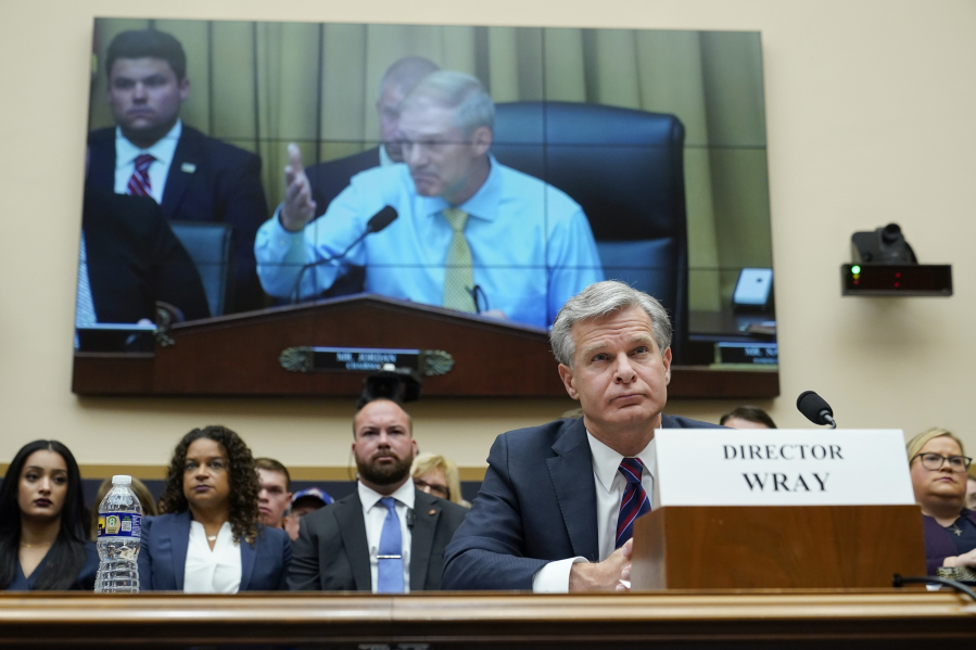 FILE - FBI Director Christopher Wray listens as Rep. Jim Jordan, R-Ohio, chair of the House Committee on the Judiciary, speaks during an oversight hearing, Wednesday, July 12, 2023, on Capitol Hill in Washington. Wray appeared before the House Judiciary Committee for the first time since Republicans took control in January.
