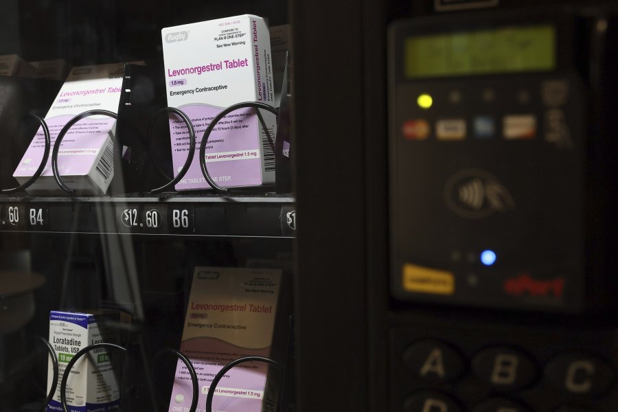 A vending machine is stocked with emergency contraceptives at Odegaard Library on the campus of the University of Washington, Friday, June 2, 2023, in Seattle.  After a student-led campaign to install the emergency contraceptive vending machine on campus in November, boxes of generic Plan B have been available to students for $12.60, a fraction of the cost charged in stores.
