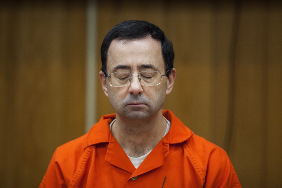 FILE - Larry Nassar listens during his sentencing at Eaton County Circuit Court in Charlotte, Mich., Feb. 5, 2018. Nassar, who was convicted of sexually abusing female gymnasts including Olympic medalists, was stabbed multiple times during an altercation with another inmate at a federal prison in Florida on Sunday, July 9, 2023.