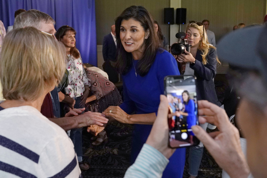 FILE - Republican presidential candidate Nikki Haley greets guests during a campaign gathering, Wednesday, May 24, 2023, in Bedford, N.H. More than a dozen candidates are seeking the nomination, including several long shots who announced their bids in recent weeks, in what is the party's most diverse presidential field ever. Yet Nikki Haley, a former U.N. ambassador and South Carolina governor, is the only woman among the bunch.