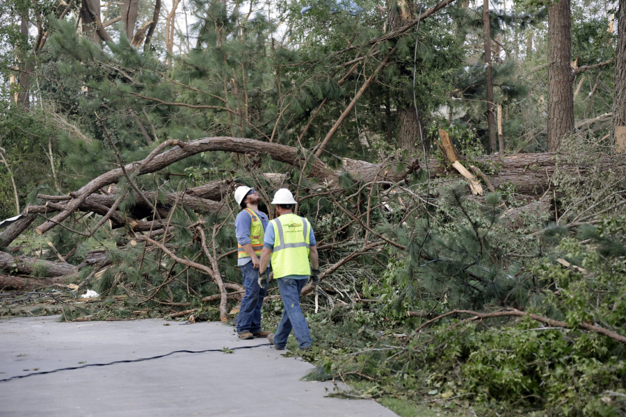 Utility crews survey damage caused by a tornado on Wednesday, July 19, 2023, on Town Hall Rd., in Dortches, N.C.