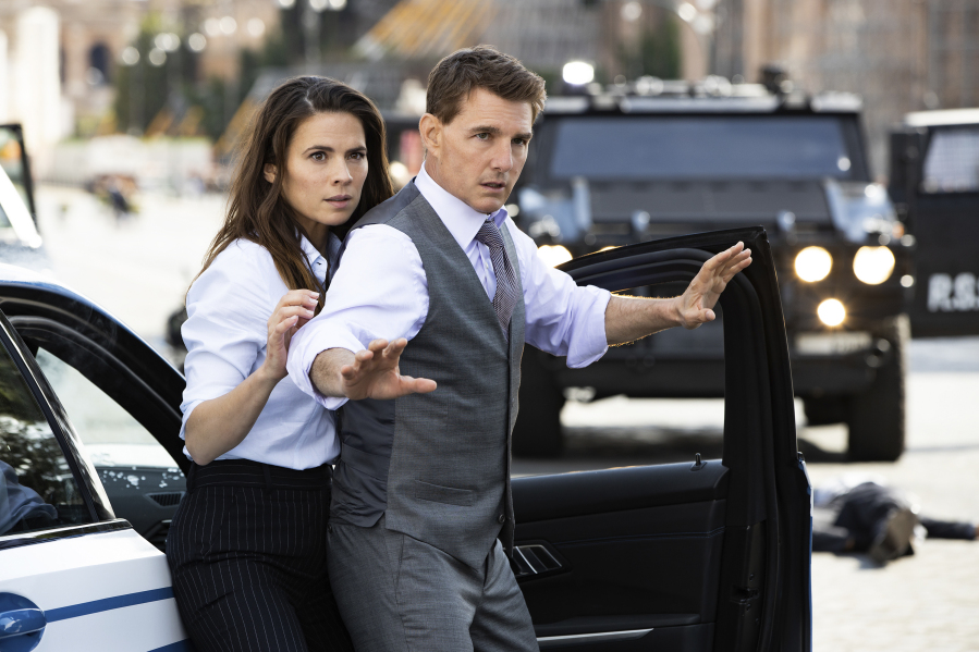 This image released by Paramount Pictures shows Hayley Atwell, left, and Tom Cruise in a scene from "Mission: Impossible - Dead Reckoning, Part One." (Paramount Pictures via AP)