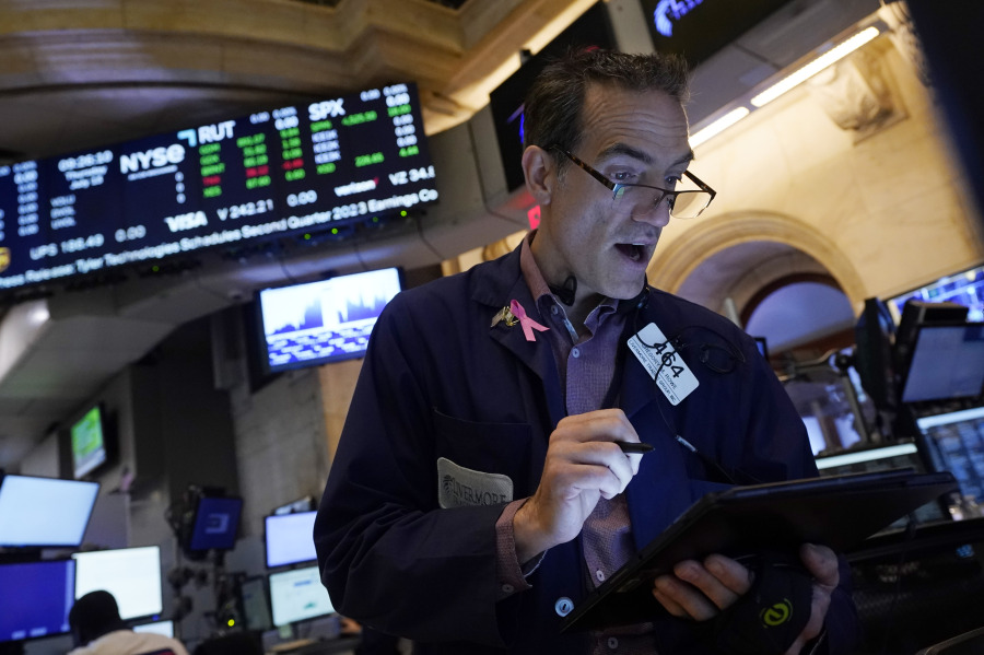 Trader Gregory Rowe works on the floor of the New York Stock Exchange, Thursday, July 13, 2023. Wall Street is adding to its winning week Thursday following the latest signal that inflation is continuing to ease its chokehold on the economy.