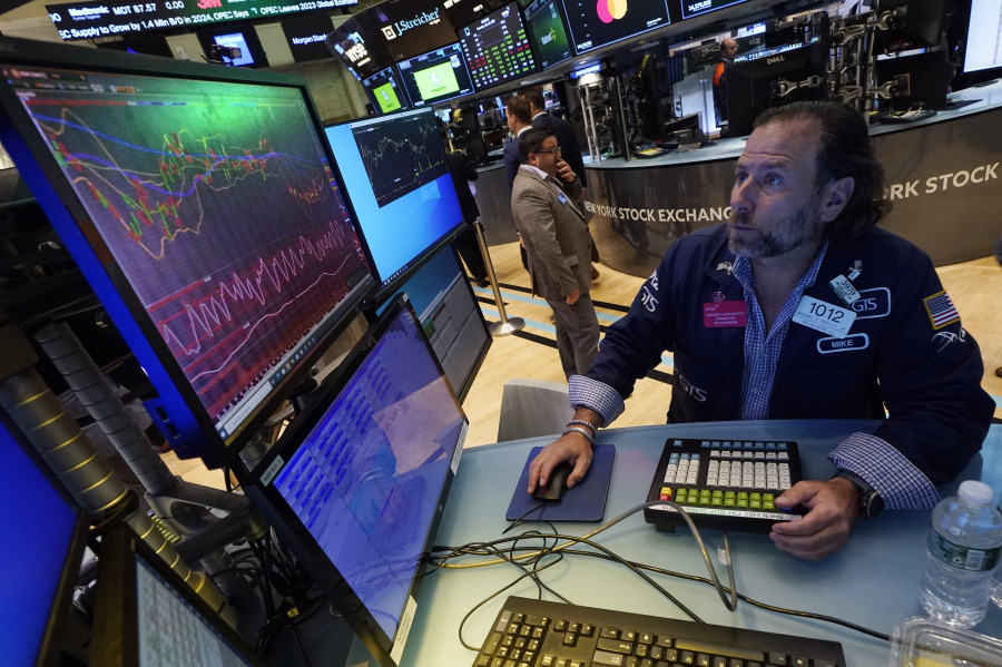 Specialist Michael Pistillo works at his post on the floor of the New York Stock Exchange, Thursday, July 13, 2023. Wall Street is adding to its winning week Thursday following the latest signal that inflation is continuing to ease its chokehold on the economy.