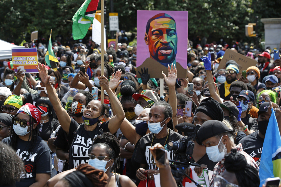 FILE - People participate in a Caribbean-led Black Lives Matter rally on June 14, 2020, at Brooklyn's Grand Army Plaza in New York. On Wednesday, July 19, 2023, New York City agreed to pay more than $13 million to settle a civil rights lawsuit brought on behalf of roughly 1,300 people who were arrested or beaten by police during racial injustice demonstrations that swept through the city during the summer of 2020.