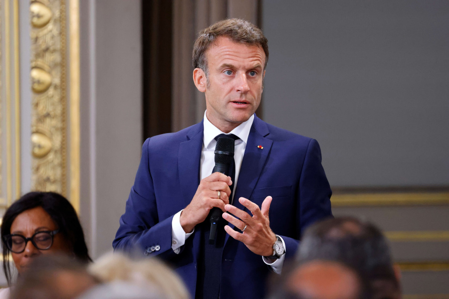 French President Emmanuel Macron addresses mayors of cities affected by the violent clashes that erupted after a teen was shot dead by police last week during a meeting at the presidential Elysee Palace in Paris Tuesday, July 4, 2023. After the death of a 17-year-old shot by police in a Paris suburb, French President Emmanuel Macron was meeting with mayors of 220 towns from across the country which were hit by violence. Across France, 34 buildings -- many of them linked to the government -- were attacked from Sunday into Monday, along with 297 vehicles.