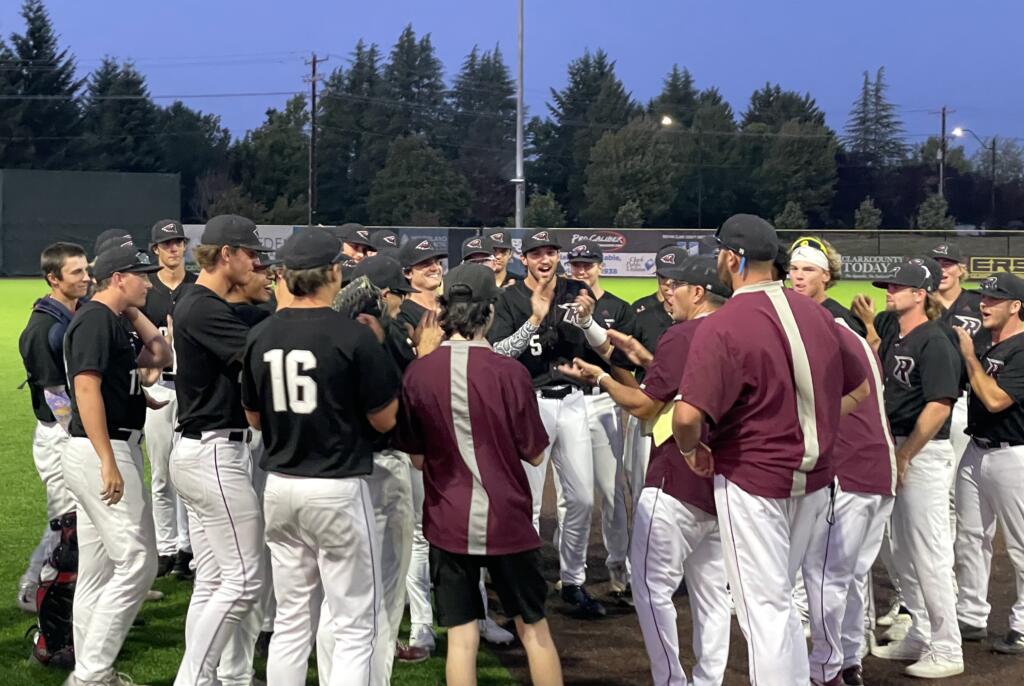 Ridgefield Raptors players and coaches cheer during their post-game meeting after clinching a West Coast League playoff berth with a win over the Portland Pickles on Wednesday, July 5, 2023, at Ridgefield Outdoor Recreation Complex.