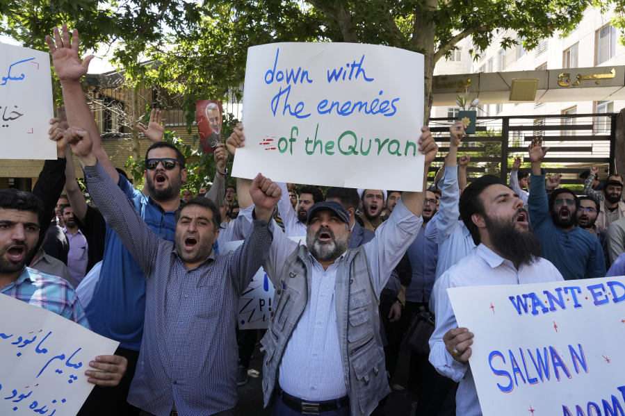 Iranian demonstrators chant slogans during a protest of the burning of a Quran in Sweden, in front of the Swedish Embassy in Tehran, Iran, Friday, June 30, 2023. On Wednesday, a man who identified himself in Swedish media as a refugee from Iraq burned a Quran outside a mosque in central Stockholm.