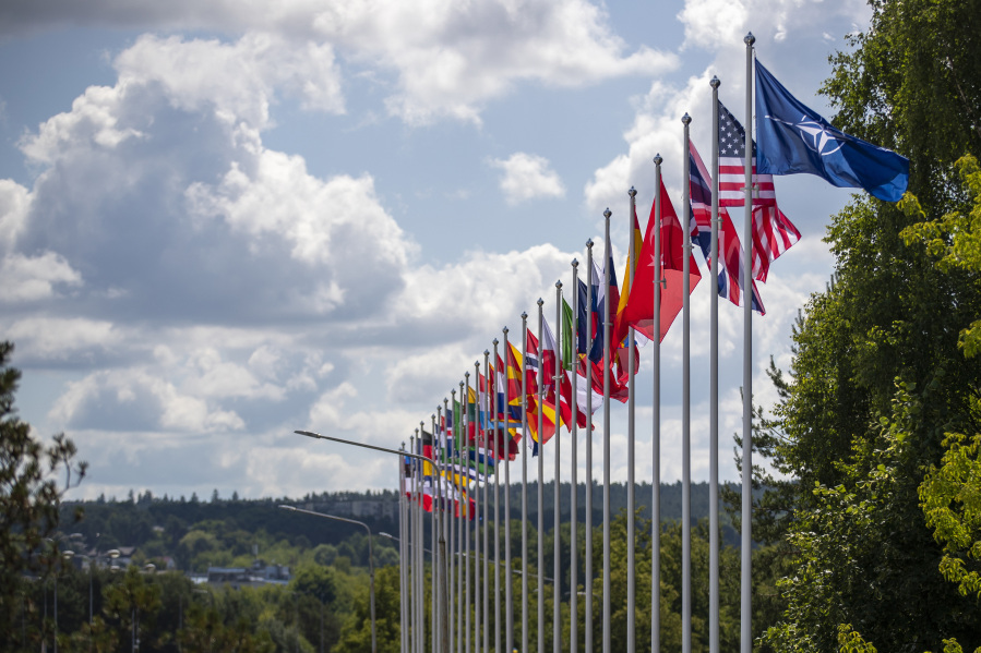 Flags of NATO member countries flap in the wind outside the venue of the NATO summit in Vilnius, Lithuania, Sunday, July 9, 2023. Russia's war on Ukraine will top the agenda when U.S. President Joe Biden and his NATO counterparts meet in the Lithuanian capital Vilnius on Tuesday and Wednesday.