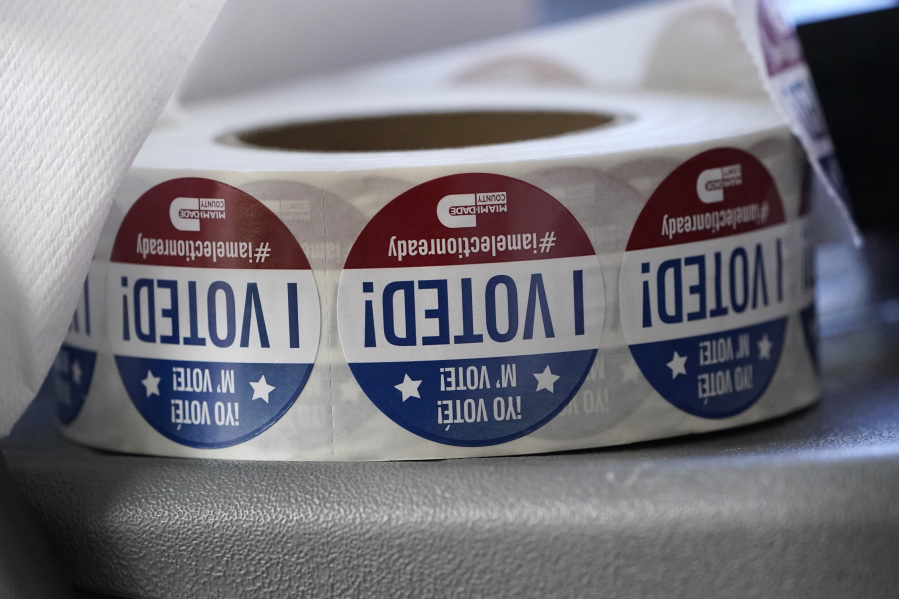 FILE - A roll of "I Voted!" stickers are shown, Oct. 6, 2020, at the Miami-Dade County Elections Department in Doral, Fla. Several new voting laws in mostly Republican-led states impose criminal penalties or fines for helping people register to vote.