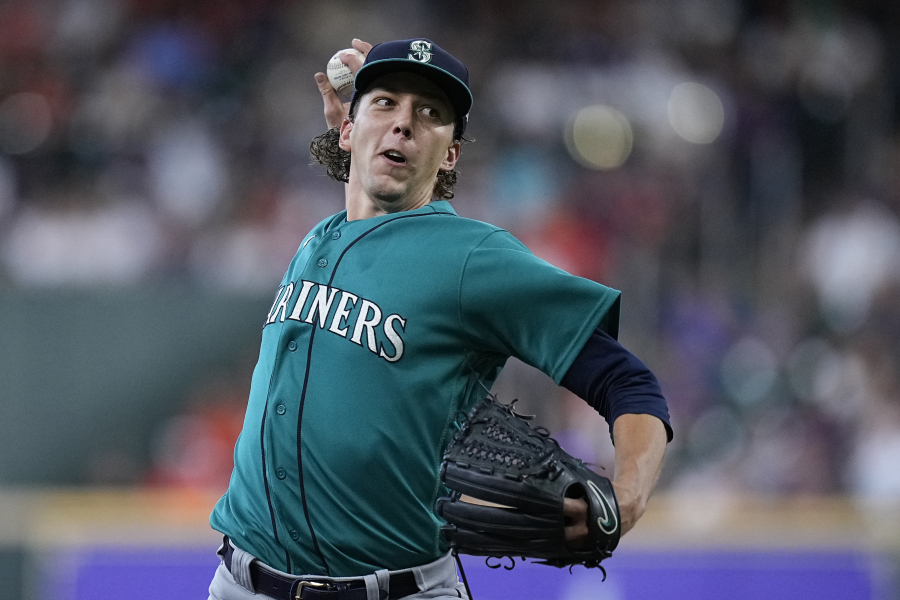 Seattle Mariners starting pitcher Logan Gilbert delivers during the first inning of a baseball game against the Houston Astros, Sunday, July 9, 2023, in Houston. (AP Photo/ (Kevin M.