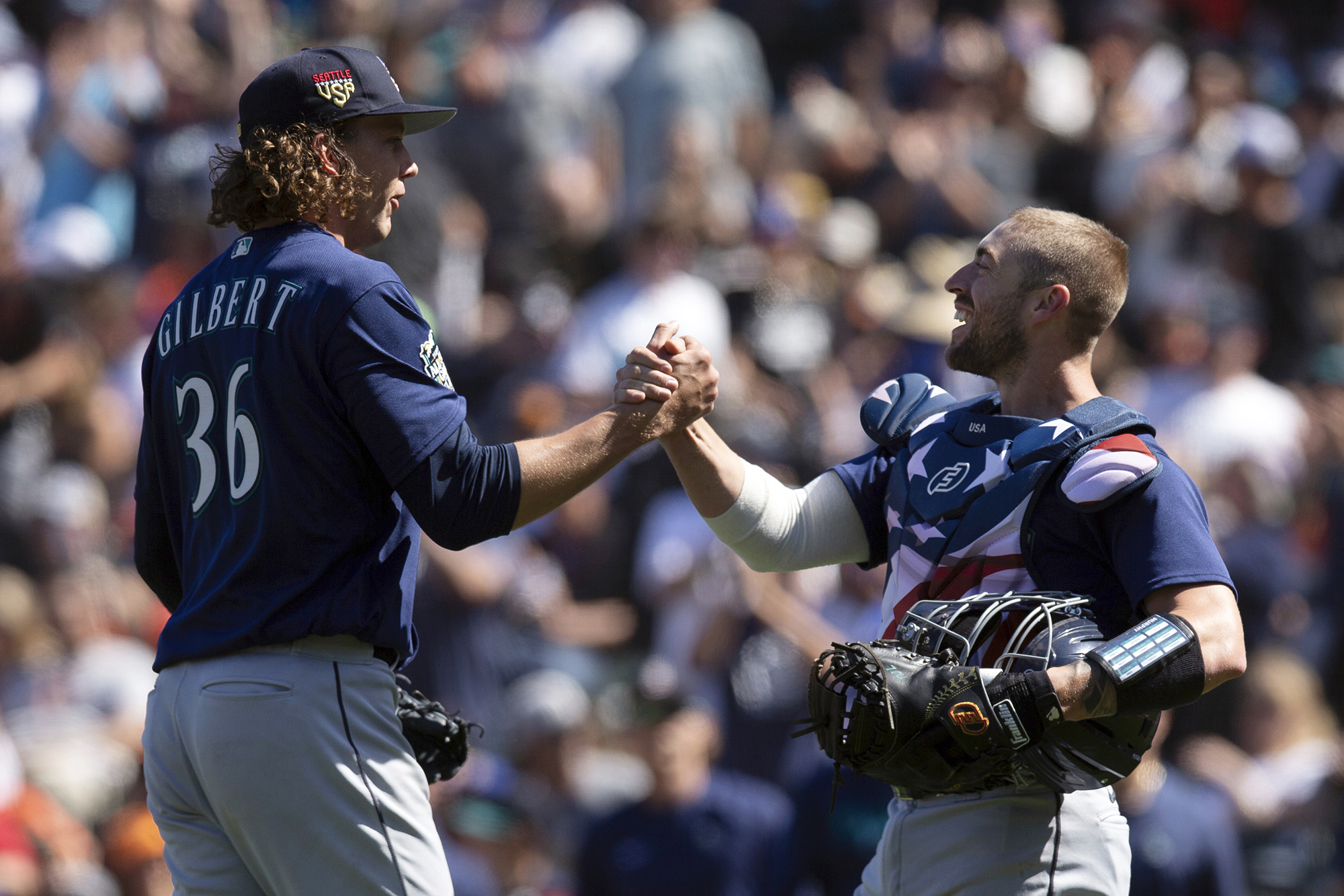 Seattle Mariners starting pitcher Logan Gilbert (36) and catcher Tom Murphy celebrate Gilbert's five-hitter against the San Francisco Giants in a baseball game, Tuesday, July 4, 2023, in San Francisco. The Mariners won 6-0. (AP Photo/D.