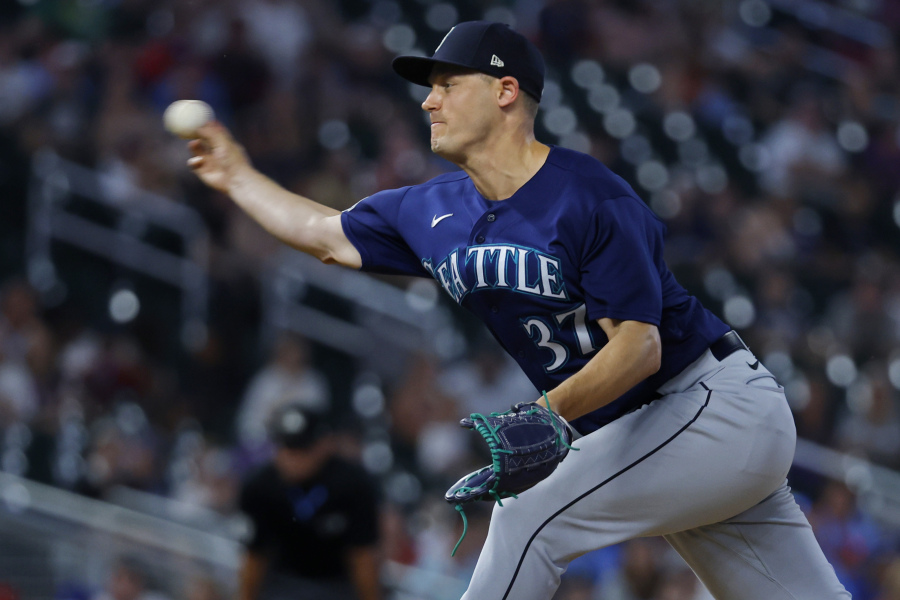 Seattle Mariners relief pitcher Paul Sewald throws to the Minnesota Twins in the 10th inning of a baseball game Monday, July 24, 2023, in Minneapolis.
