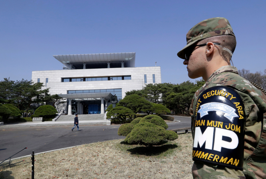 FILE - A U.S. soldier stands outside of the Peace House, the venue for the planned summit between South Korean President Moon Jae-in and North Korean leader Kim Jong Un during a press tour at the southern side of the Panmunjom in the Demilitarized Zone, South Korea on April 18, 2018. An American has crossed the heavily fortified border from South Korea into North Korea, the American-led U.N. Command overseeing the area said Tuesday, July 18, 2023, amid heightened tensions over North Korea's nuclear program.
