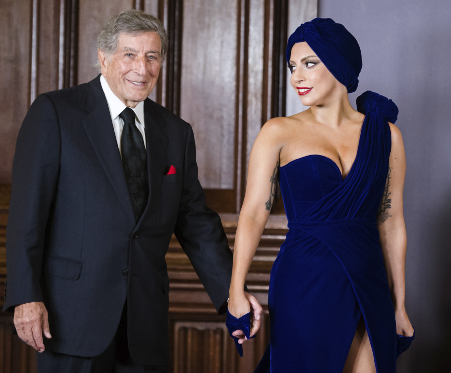 Tony Bennett, left, and Lady Gaga appear for a media event at city hall in Brussels on Sept. 22, 2014. Bennett died Friday at age 96.