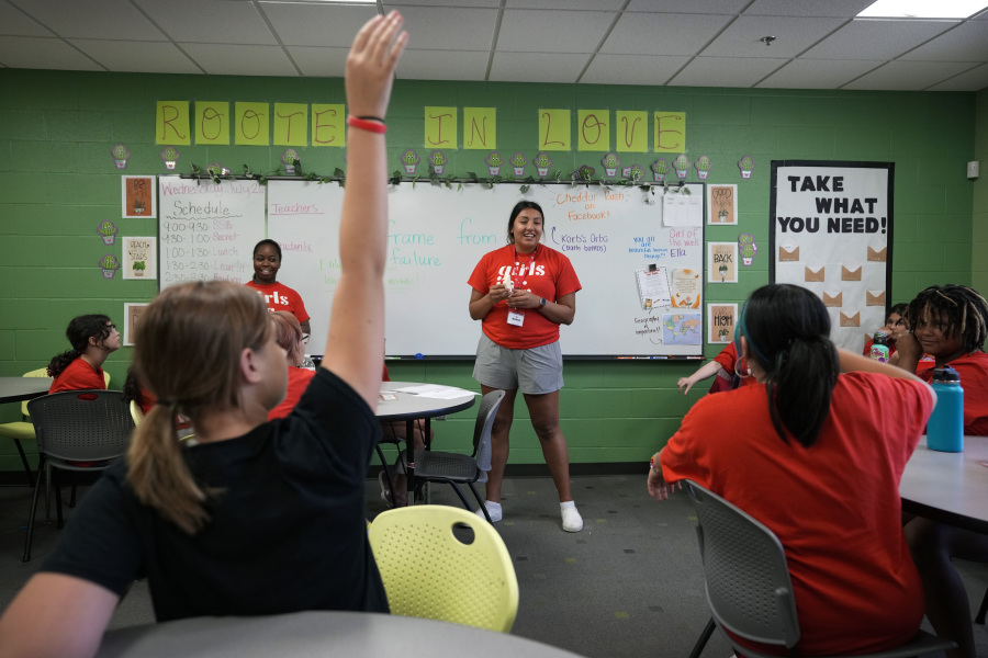 Program Specialist Andrea Vazquez, center, and Program Director Olivia Ray, left, lead a class discussion during a Lean In session at Girls Inc., Wednesday, July 26, 2023, in Sioux City, Iowa. A new girls leadership program from Lean In, the organization launched after Sheryl Sandberg published her book, "Lean In: Women, Work and the Will to Lead," will help girls respond to what Sandberg calls stubborn gender inequities.