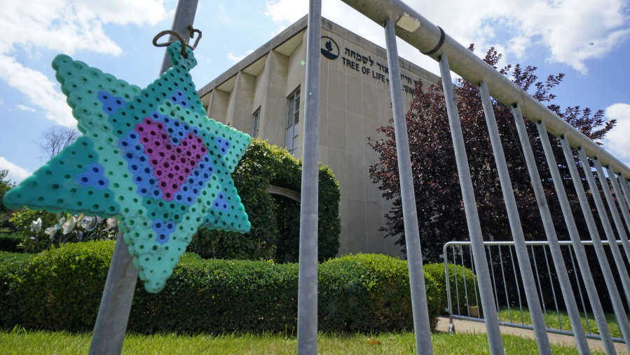 A Star of David hands from a fence outside the dormant landmark Tree of Life synagogue in Pittsburgh's Squirrel Hill neighborhood on Thursday, July 13, 2023, the day a federal jury announced they had found Robert Bowers, who in 2018 killed 11 people at the Tree of Life synagogue, eligible for the death penalty. The next stage of the trial with present further evidence and testimony on whether he should be sentenced to death or life in prison. It stands as the deadliest attack on Jewish people in U.S. history. (AP Photo/Gene J.