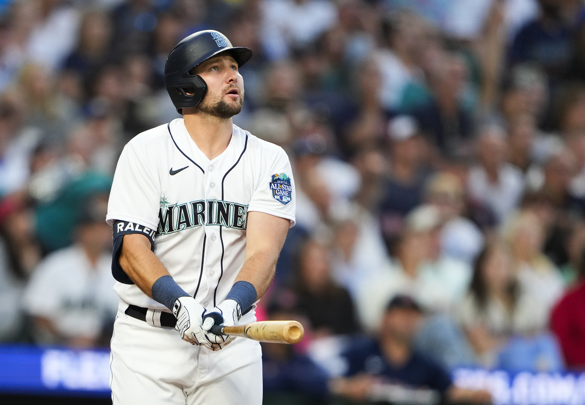 Seattle Mariners' Cal Raleigh watches his solo home run, his second of the night, against the Boston Red Sox go over the fence during the seventh inning of a baseball game, Monday, July 31, 2023, in Seattle.