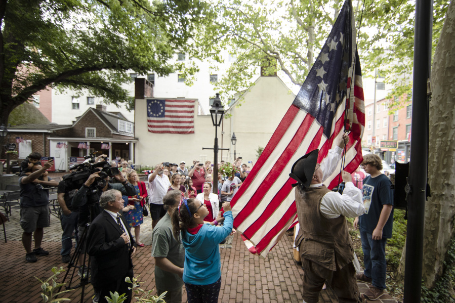 An American flag is hoisted June 14, 2019, at the Betsy Ross House in Philadelphia on Flag Day.