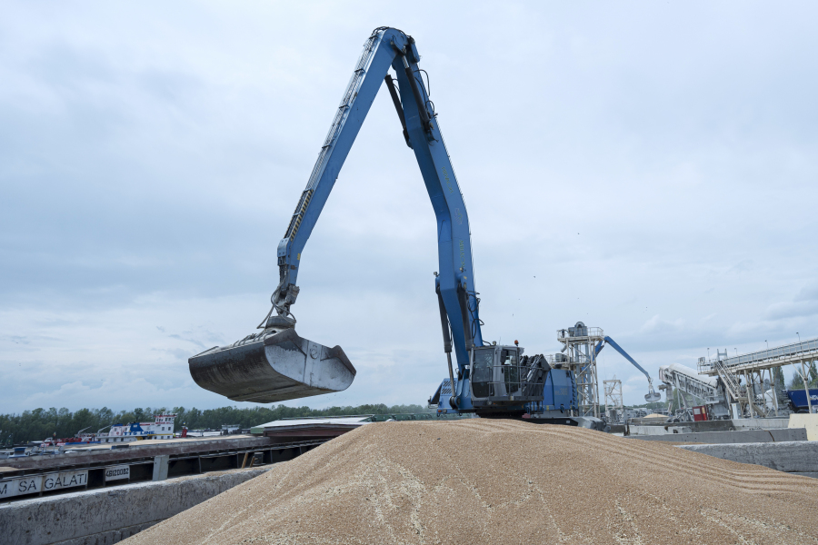 FILE - An excavator loads grain into a cargo ship at a grain port in Izmail, Ukraine, on April 26, 2023. Russia has suspended on Monday July 17, 2023 a wartime deal brokered by the U.N. and Turkey that was designed to move food from Ukraine to parts of the world where millions are going hungry.