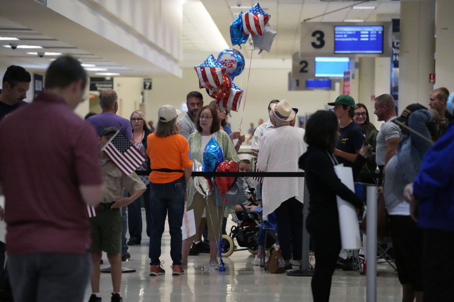 People wait for arriving passengers at Midway International Airport in Chicago Wednesday, July 12, 2023. A tornado touched down Wednesday evening near Chicago's O'Hare International Airport, prompting passengers to take shelter and disrupting hundreds of flights. (AP Photo/Nam Y.
