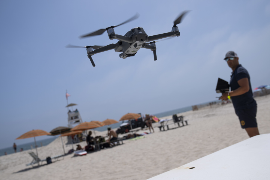 Cary Epstein, lifeguarding supervisor, operates a drone during takeoff for a shark patrol flight at Jones Beach State Park, Thursday, July 6, 2023, in Wantagh, N.Y. Drones are sweeping over the ocean off the coast of New York's Long Island to patrol the waters for any danger possibly lurking.