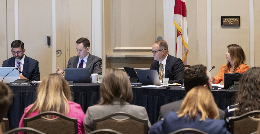The State Board of Education members, from left to right, Manny Diaz Jr., Ben Gibson, Ryan Petty, and Kelly Garcia meet to make a decision on whether to adopt a number of rules required by new state laws in Orlando, Fla., Wednesday, July 19, 2023. (Willie J.
