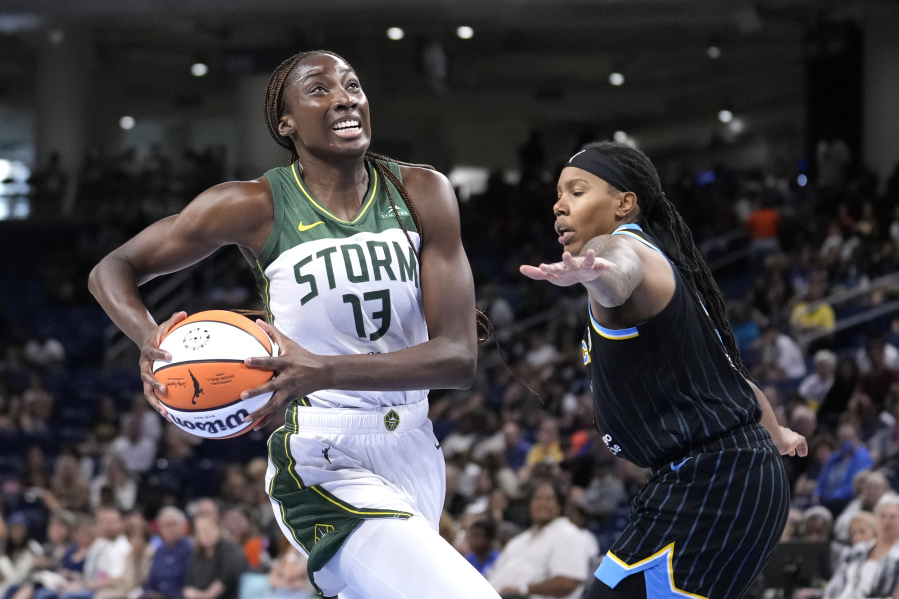 Seattle Storm's Ezi Magbegor drives to the basket as Chicago Sky's Elizabeth Williams defends during the first half of a WNBA basketball game Friday, July 28, 2023, in Chicago.